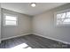 Bright bedroom with wood-look floors and two windows at 1691 Montevista Dr, Shelby, NC 28150