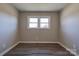 Simple bedroom with double window and wood-look floors at 1691 Montevista Dr, Shelby, NC 28150