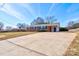 Brick ranch home with a large driveway and well-maintained lawn at 1691 Montevista Dr, Shelby, NC 28150