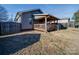 Covered deck with wooden pergola and built in seating at 17 Walnut St, China Grove, NC 28023