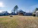 Large backyard with firepit, shed, and covered deck at 17 Walnut St, China Grove, NC 28023