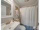 Clean bathroom with shower/tub combo and updated vanity at 17 Walnut St, China Grove, NC 28023