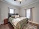 Charming bedroom with wood flooring and a large bed at 17 Walnut St, China Grove, NC 28023