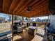 Relaxing covered patio with seating area and ceiling fan at 17 Walnut St, China Grove, NC 28023