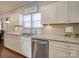 Modern kitchen features white cabinets and granite counters at 17 Walnut St, China Grove, NC 28023