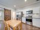 Updated kitchen featuring stainless steel appliances and a wood barn door at 17 Walnut St, China Grove, NC 28023