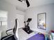 Bedroom featuring exercise bike, ceiling fan, closet, and large mirror at 17004 Commons Creek Dr, Charlotte, NC 28277