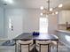 Modern dining room with elegant lighting and stylish decor in neutral tones at 17004 Commons Creek Dr, Charlotte, NC 28277