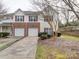 Exterior view of a two story townhome with attached garages at 17004 Commons Creek Dr, Charlotte, NC 28277