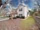 Exterior view of a two story townhome with attached garages and lawn at 17004 Commons Creek Dr, Charlotte, NC 28277