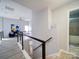 Bright, airy loft with metal railings, a view of living space and a modern shower at 17004 Commons Creek Dr, Charlotte, NC 28277