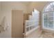 Bathroom showcases a frameless glass shower, soaking tub, and ample natural light at 1915 Cavendale Dr, Rock Hill, SC 29732