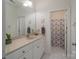 Bright bathroom featuring a single sink vanity with a neutral countertop and a framed mirror at 1915 Cavendale Dr, Rock Hill, SC 29732