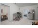 Bright kitchenette area featuring a stainless steel refrigerator and stainless steel worktable at 1915 Cavendale Dr, Rock Hill, SC 29732