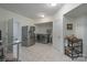 Spacious laundry room featuring modern washer and dryer units and a stainless steel refrigerator at 1915 Cavendale Dr, Rock Hill, SC 29732