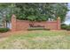 Welcoming brick neighborhood sign for Wedgewood amidst a green and landscaped entrance at 1915 Cavendale Dr, Rock Hill, SC 29732