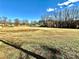 Expansive vacant grassy lot offering potential for development or recreational use at 19412 S Hill St, Cornelius, NC 28031