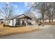 Newly built white house with a gray roof and front yard at 19601 S Ferry St, Cornelius, NC 28031