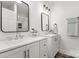 Modern bathroom with double vanity, frameless shower, and stylish fixtures at 19601 S Ferry St, Cornelius, NC 28031