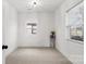 Well-lit bedroom with neutral carpeting and window at 19601 S Ferry St, Cornelius, NC 28031