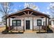 Charming white house with a modern farmhouse style and a welcoming front porch at 19601 S Ferry St, Cornelius, NC 28031