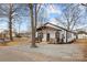 New construction home with a front porch and gravel driveway at 19601 S Ferry St, Cornelius, NC 28031