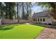 Artificial turf backyard with a home and wooden fence at 2043 Shenandoah Ave, Charlotte, NC 28205