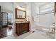 Classic bathroom with subway tile, soaking tub, and vanity at 2043 Shenandoah Ave, Charlotte, NC 28205