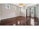 Bright bedroom with hardwood floors and window with curtains at 2043 Shenandoah Ave, Charlotte, NC 28205