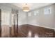 Spacious bedroom with dark hardwood floors and an ensuite bathroom at 2043 Shenandoah Ave, Charlotte, NC 28205