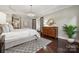 Bright bedroom with hardwood floors and access to bathroom at 2043 Shenandoah Ave, Charlotte, NC 28205