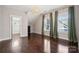 Bedroom with hardwood floors, large windows, and walk-in closet at 2043 Shenandoah Ave, Charlotte, NC 28205