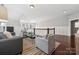 Bonus room with hardwood floors, seating area, and balcony view at 2043 Shenandoah Ave, Charlotte, NC 28205