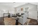 Bright bonus room with hardwood floors and seating area at 2043 Shenandoah Ave, Charlotte, NC 28205