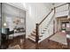 Grand entryway with hardwood floors, staircase, and home office at 2043 Shenandoah Ave, Charlotte, NC 28205