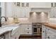 Modern kitchen with white cabinets and farmhouse sink at 2043 Shenandoah Ave, Charlotte, NC 28205