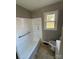 Clean bathroom with a bathtub, toilet, and vanity at 2505 Druid Hills Way, Charlotte, NC 28206