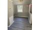 Dining area with gray walls and wood-look flooring at 2505 Druid Hills Way, Charlotte, NC 28206