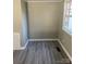 Dining area with gray walls and wood-look flooring at 2505 Druid Hills Way, Charlotte, NC 28206