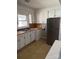 Kitchen with white cabinets and wood countertops at 2505 Druid Hills Way, Charlotte, NC 28206