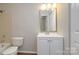 Clean bathroom with white vanity and updated fixtures at 2514 Cranbrook Ln # 5, Charlotte, NC 28207