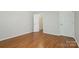 Well-lit bedroom featuring hardwood floors and ample closet space at 2514 Cranbrook Ln # 5, Charlotte, NC 28207