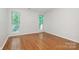 Spacious bedroom with hardwood floors and large windows at 2514 Cranbrook Ln # 5, Charlotte, NC 28207