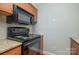 Kitchen boasts granite countertops and modern appliances at 2514 Cranbrook Ln # 5, Charlotte, NC 28207