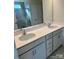 Double vanity bathroom with quartz countertop and gray cabinets at 2632 Tillman St, Monroe, NC 28112