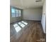 Bright living room with hardwood floors and large windows at 2632 Tillman St, Monroe, NC 28112