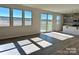 Open living area with sliding glass doors leading to patio at 2632 Tillman St, Monroe, NC 28112