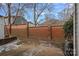 Small backyard with brick wall and some patchy ground at 3026 Uxbridge Woods Ct, Charlotte, NC 28205