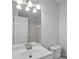 Updated bathroom with a bathtub and double sink vanity at 3026 Uxbridge Woods Ct, Charlotte, NC 28205