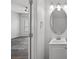 Small bathroom with white vanity, oval mirror, and toilet at 3026 Uxbridge Woods Ct, Charlotte, NC 28205